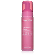Pink bottle of Rizos Curls Curl Defining Mousse on a white background